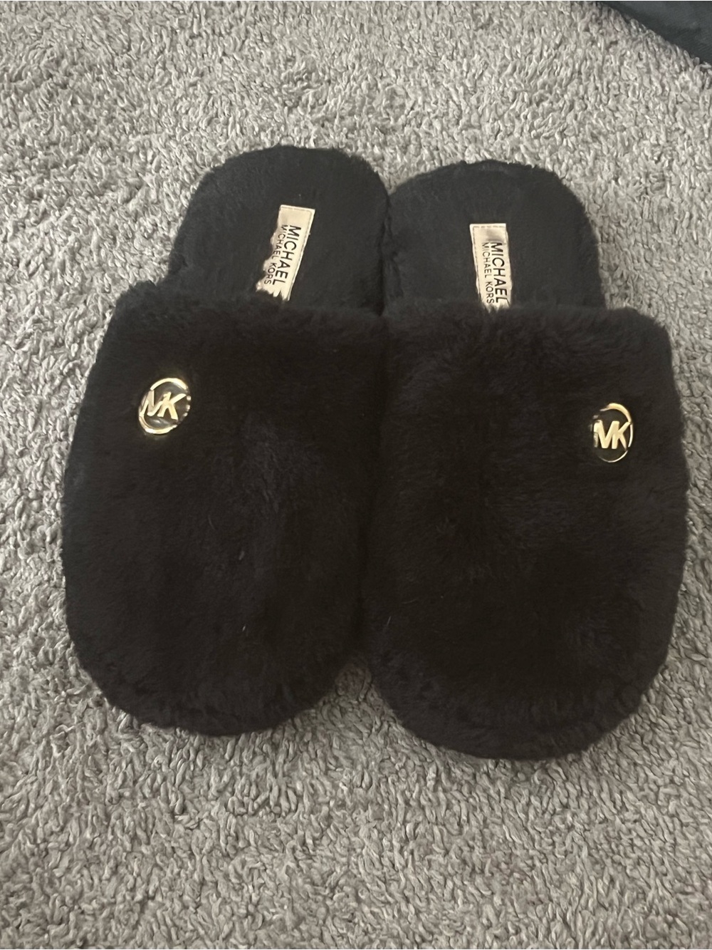 Michael Kors Black Faux-Fur Slip-Ons with Gold MK Emblem